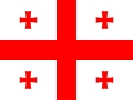 La imagen muestra la bandera de Georgia, que presenta una cruz roja en el centro sobre un fondo blanco con cruces adicionales en las esquinas.
