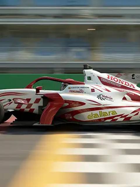 Un coche de carreras de fórmula cruzando la línea de meta.