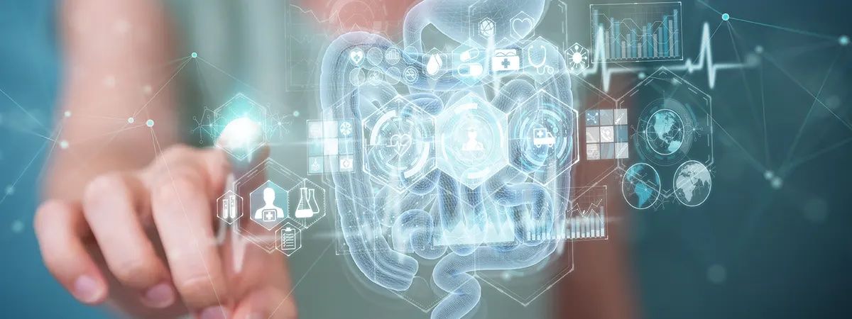 La imagen muestra una representación holográfica del sistema digestivo y gráficos relacionados con la salud.