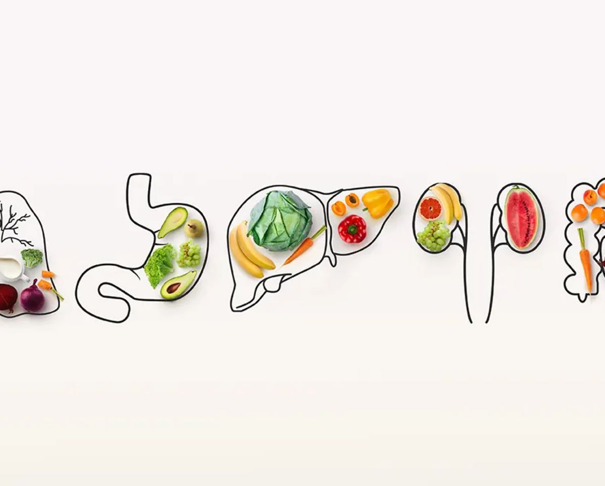 La imagen presenta una representación artística de la palabra 'happiness' hecha con verduras y frutas.