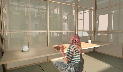 Una persona sentada en una mesa de madera en un espacio minimalista y moderno.