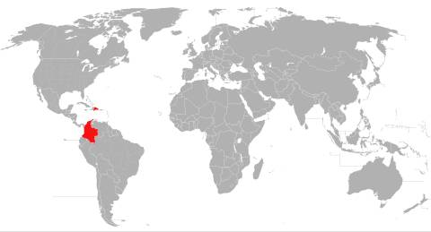 Mapa del mundo con Colombia destacada en rojo.